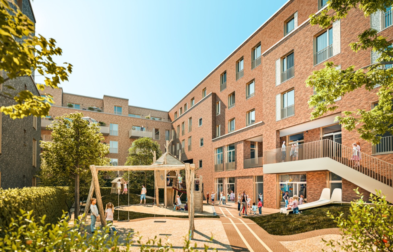 Kinder spielen auf dem Spielplatz im begrünten Innenhof des ZOHO-Quartiers