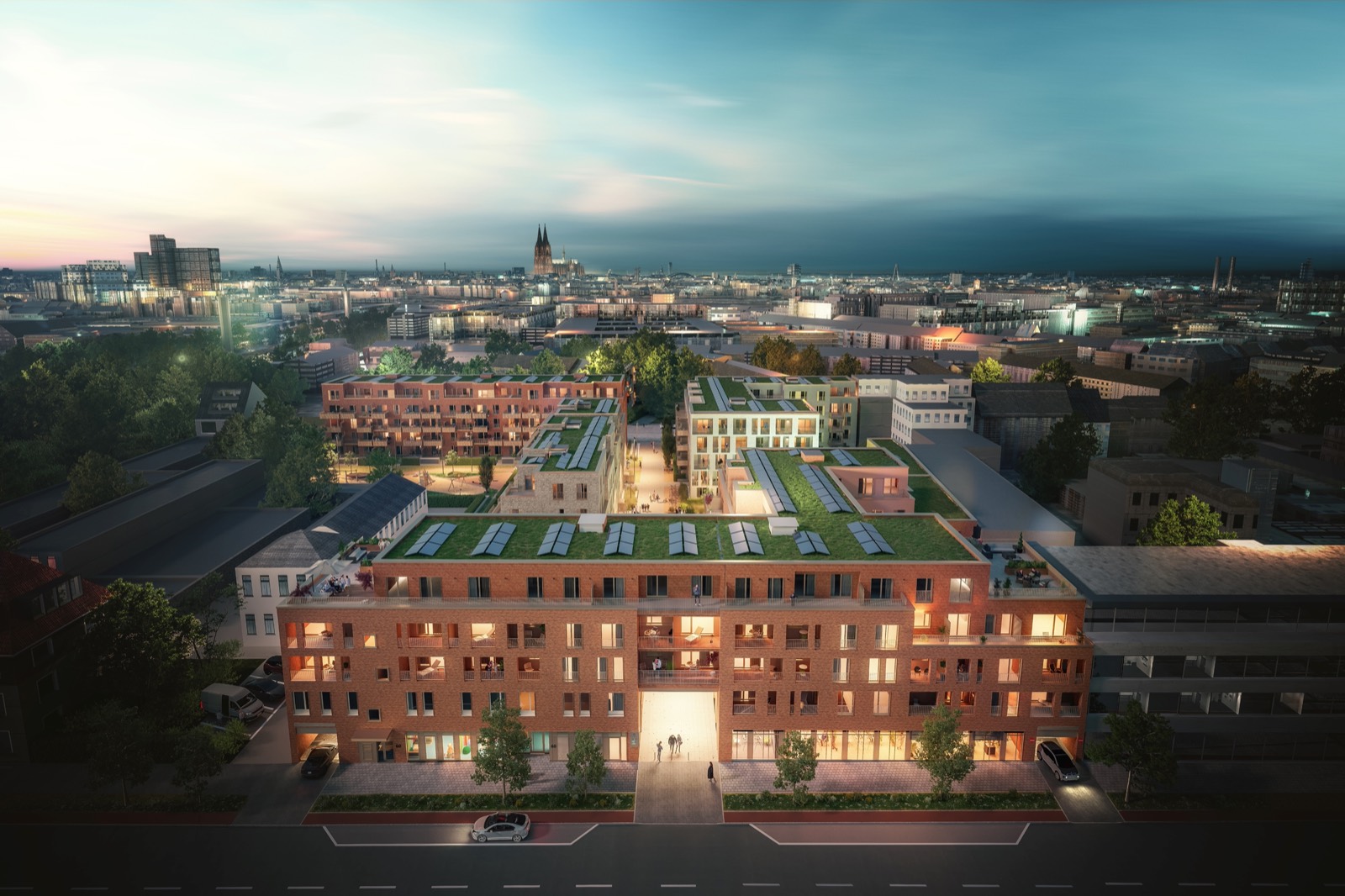 Außenansicht des neuen ZOHO-Wohnquartiers in Köln-Zollstock mit begrünten Innenhöfen